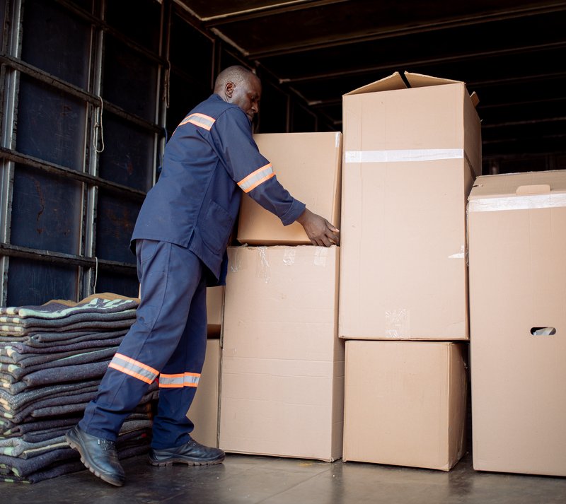 Mover stacking boxes in a warehouse